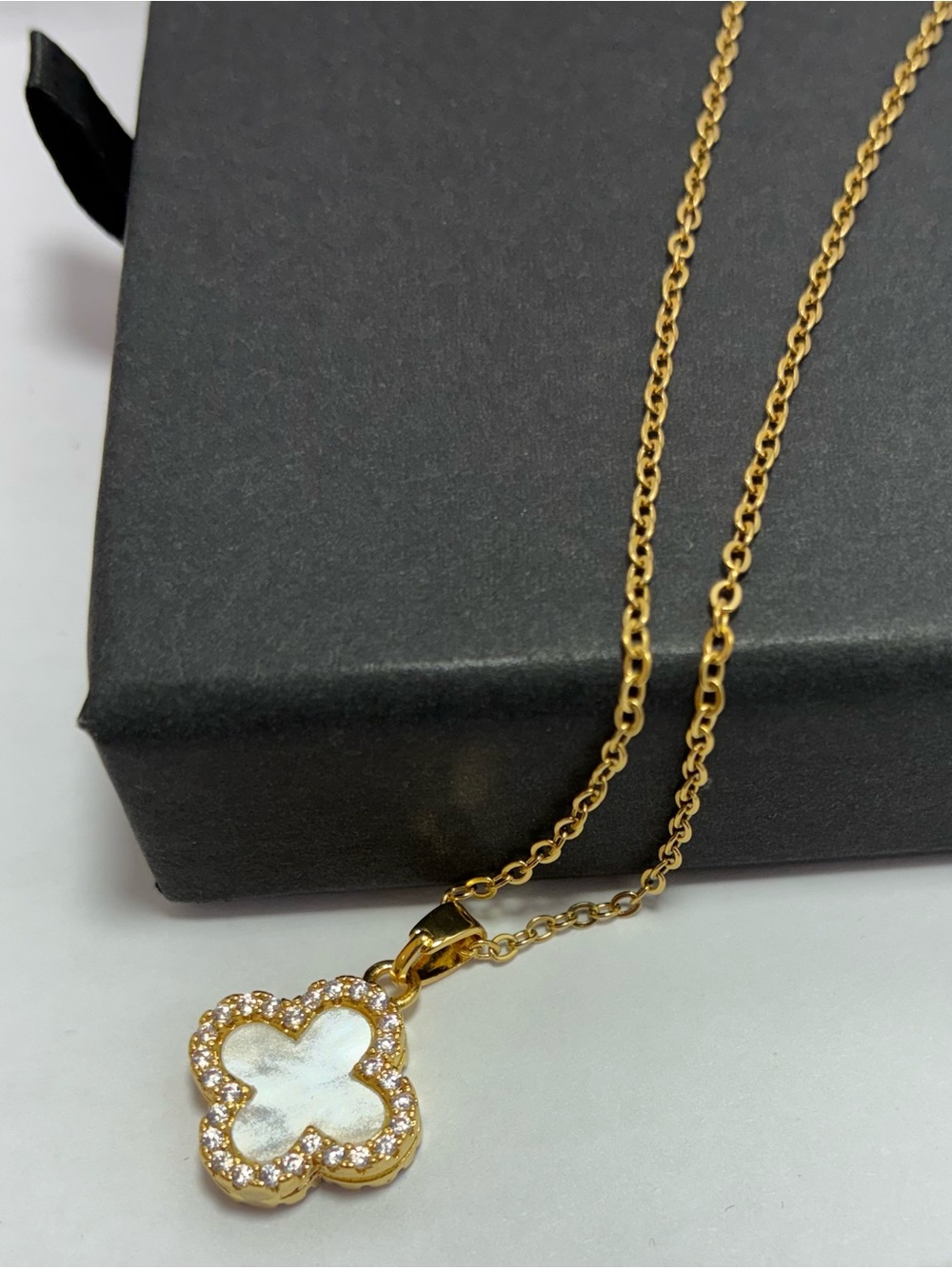 Gold Tone Clover Pendant Necklace with White/Black Clover Accent